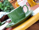 Зеленая кофейная чашка