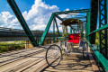 Трицикл на деревянном мосту