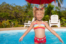 17925972-little-girl-in-the-pool