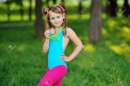 181328580-a-girl-in-a-gymnastic-swimsuit-with-a-medal-around-her-neck-childrens-sports
